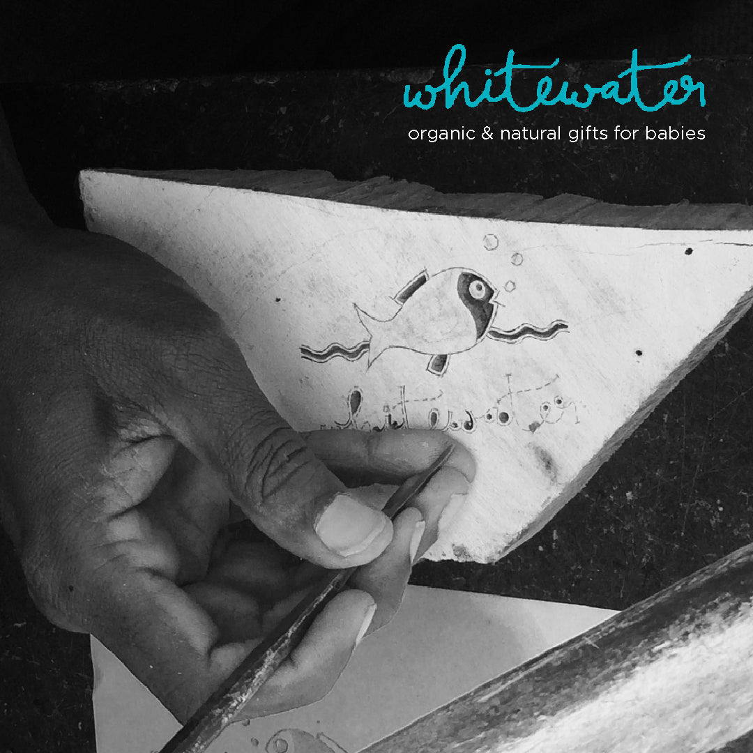 Whitewater Textile LLP making of the logo by hand carving wood