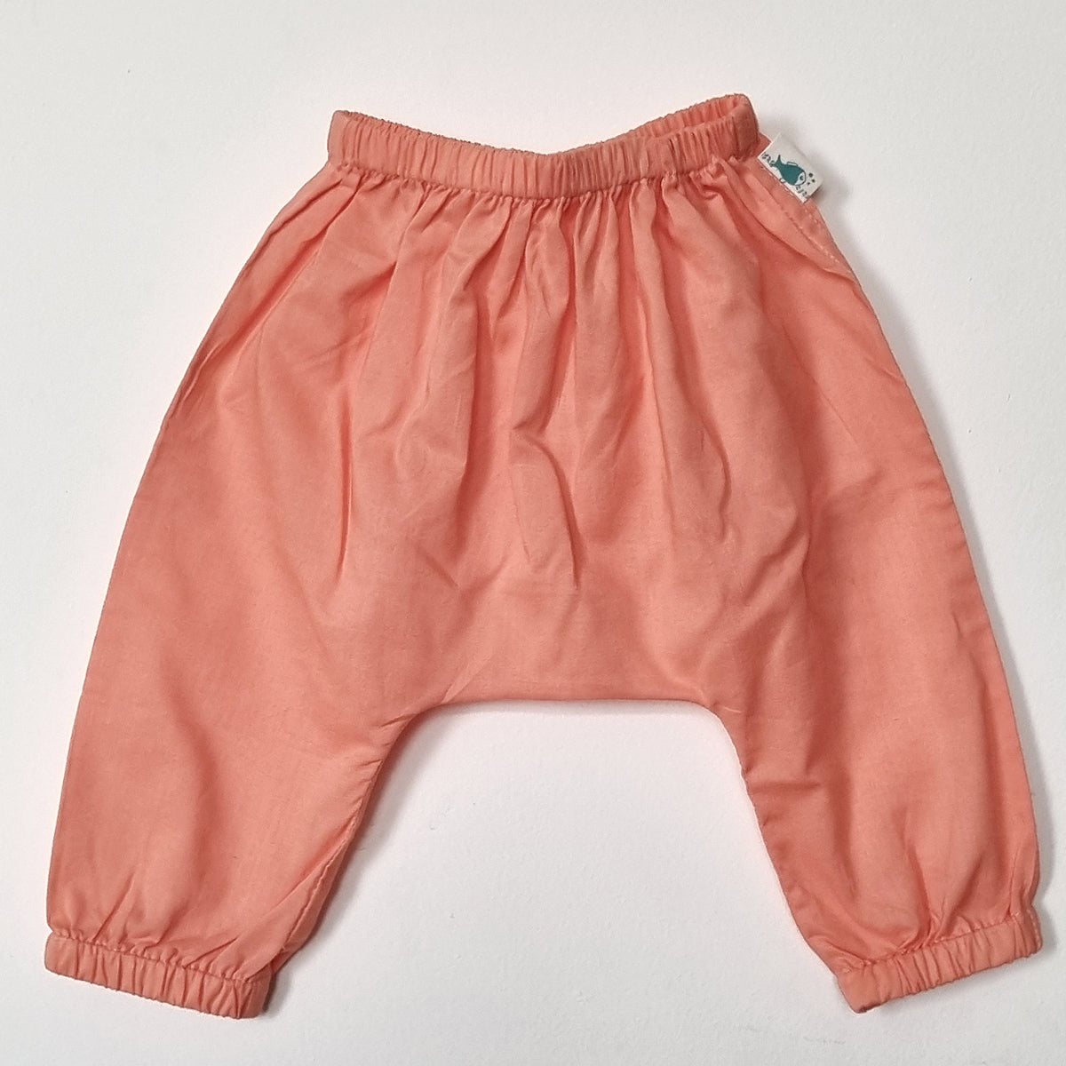 Pink baby pants on a white background